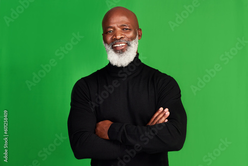 Tableau sur toile Happy, arms crossed and portrait of black man on green screen for confident, fashion and elegant style