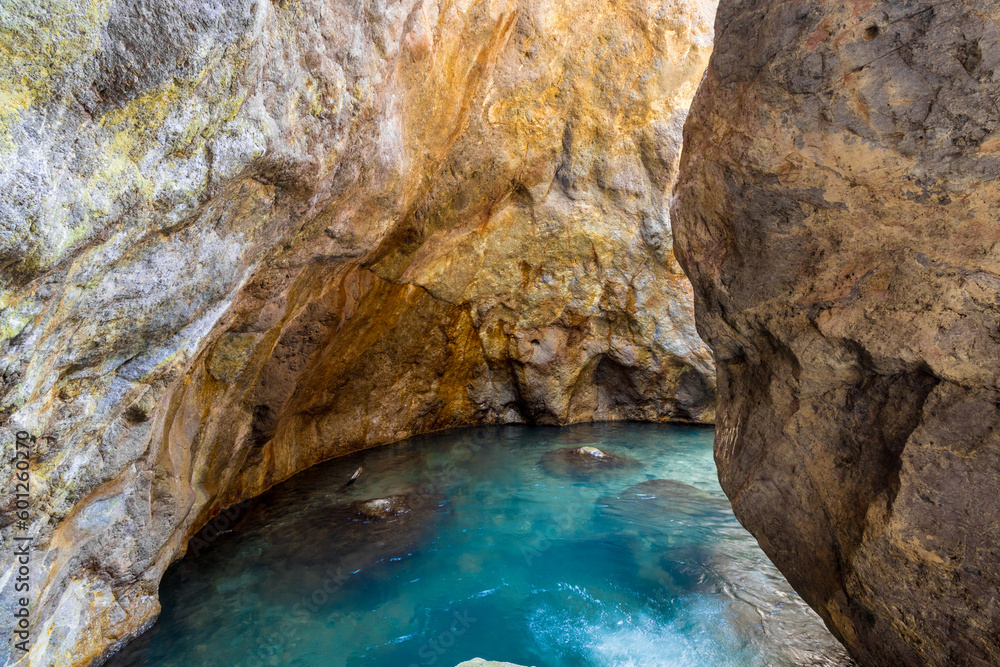 beautiful turquoise natural pool in a rocky cave in the province of Puntarenas in Costa Rica