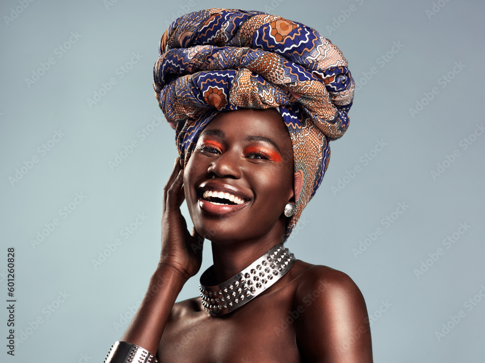 Head scarf, black woman laugh and portrait with African beauty and makeup in a studio. Isolated, grey background and traditional fashion with a female model pride with culture cosmetics and jewelry - obrazy, fototapety, plakaty 