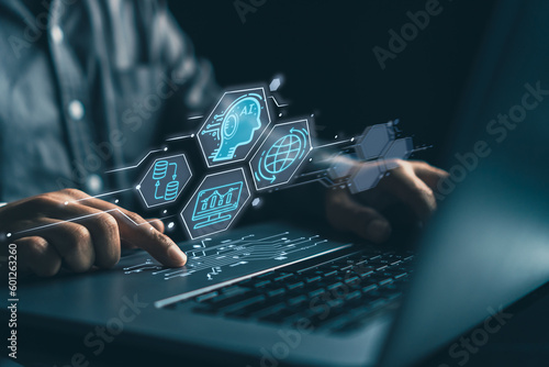 Business man using artificial intelligence on laptop computer, futuristic technology concept , network and communication database file transfer help by ai