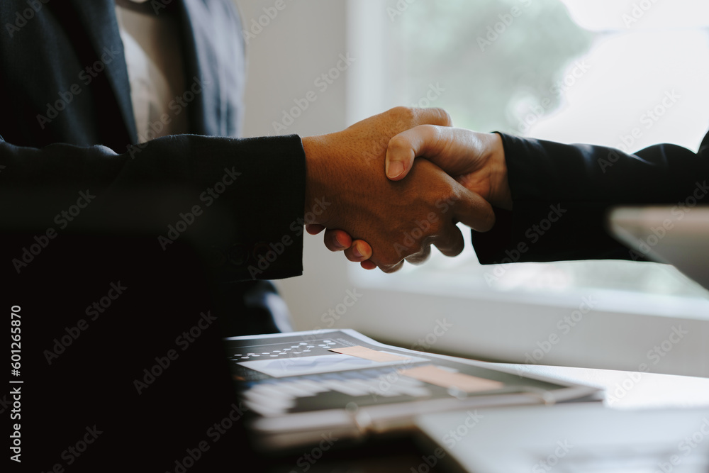 close up of business people shaking hands, finance accounting concept. close up of business people shaking hands, finance accounting concept.
