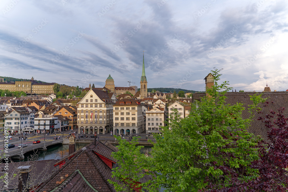 Scenic view of the old town of City of Zürich in evening sunlight on a cloudy spring day. Photo taken May 6th, 2023, Zurich, Switzerland.
