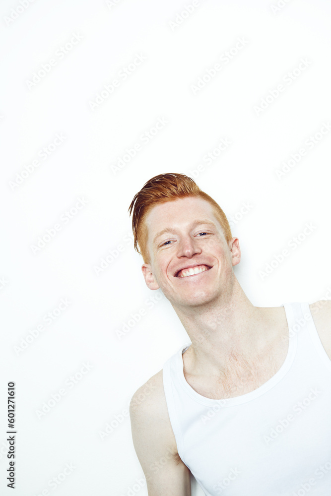 Portrait, smile and face of a man in studio with a smile, happiness and a positive attitude. Unique male model person with ginger or red hair isolated on a white background with mockup space Portrait, smile and face of a man in studio with a smile, happiness and a positive attitude. Unique male model person with ginger or red hair isolated on a white background with mockup space