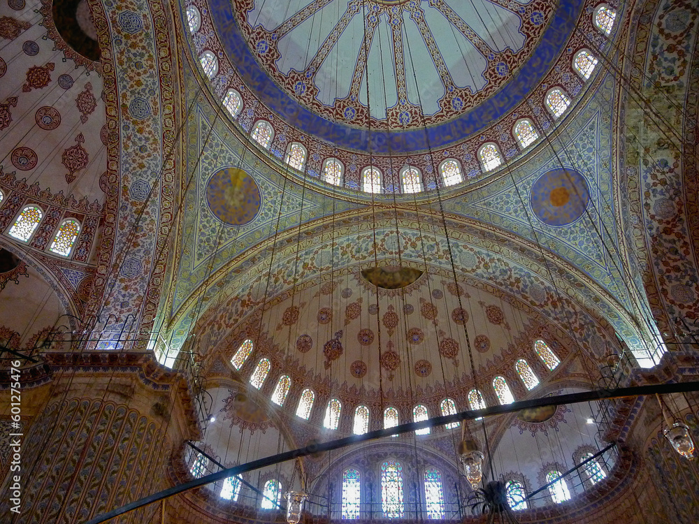 Opulent murals and ceiling wall paintings inside Arabic mosque with columns, domes, high walls and lots of windows for daylight impressive interior design and construction architecture from 1001 night