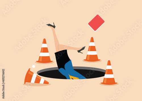 Terrified business woman fall down into the hole