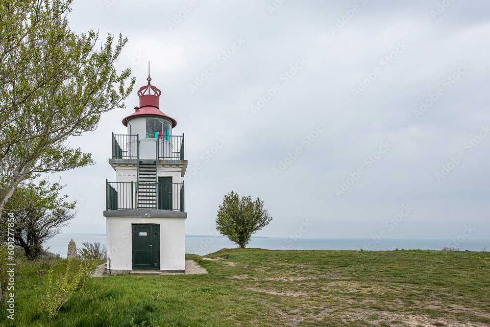 Spodsbjerg lighthouse overlooking a beach meadow and the sea