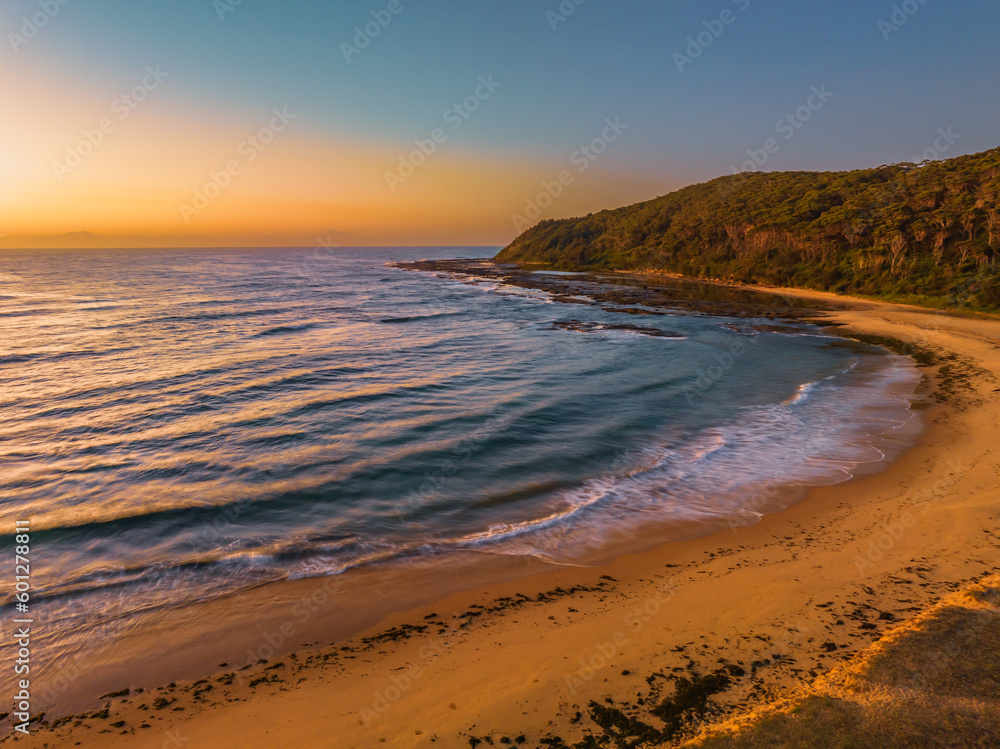 Aerial sunrise seascape with  beach and clear skies