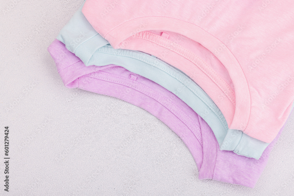 Eco friendly spring closet cleaning, capsules for machine washing. Pastel T-shirts, sale concept Eco friendly spring closet cleaning, capsules for machine washing. Pastel T-shirts, sale concept