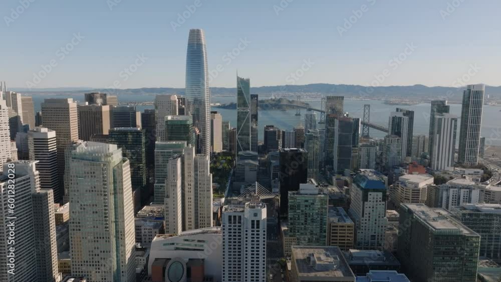 Aerial slide and pan shot of modern downtown buildings around majestic Salesforce Tower. San Francisco, California, USA Aerial slide and pan shot of modern downtown buildings around majestic Salesforce Tower. San Francisco, California, USA