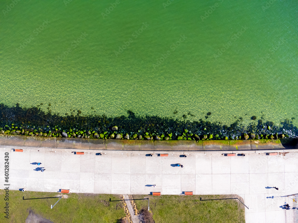 Aerial view landscape Poland Gdynia, city boulevard , drone photo, Baltic sea, concrete promenade, rocky coast.