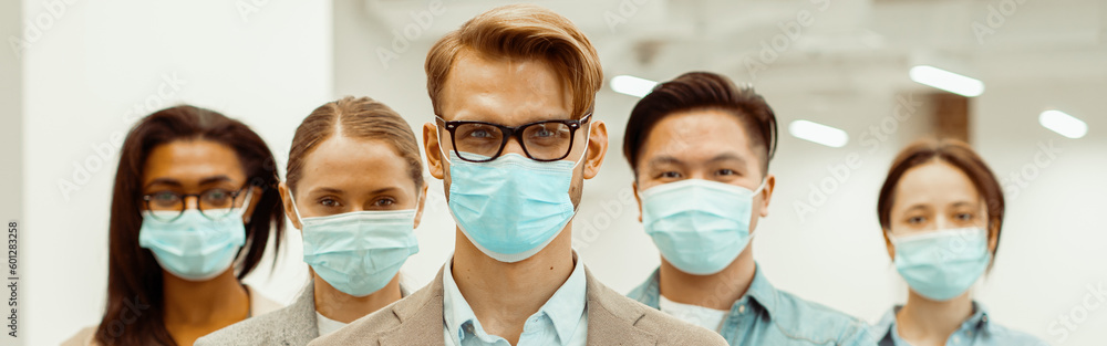 Manager with colleagues in facial covers protect from COVID-19 coronavirus Manager with colleagues in facial covers protect from COVID-19 coronavirus