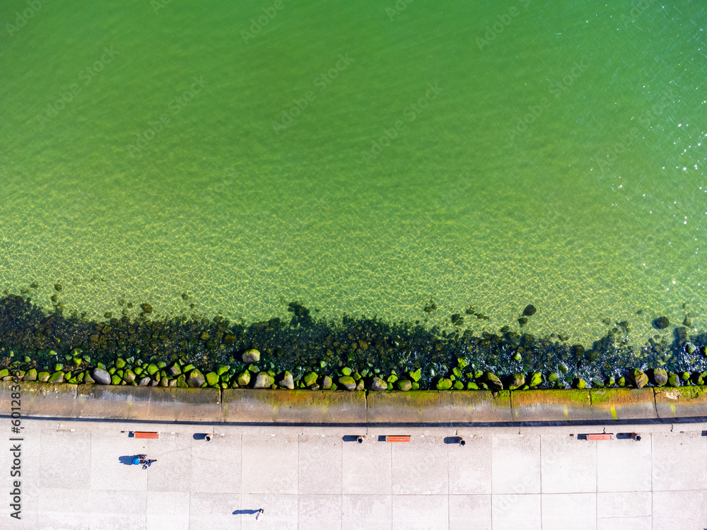 Aerial view landscape Poland Gdynia, city boulevard , drone photo, Baltic sea, concrete promenade, rocky coast.