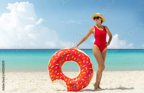 Beautiful woman with inflatable donut