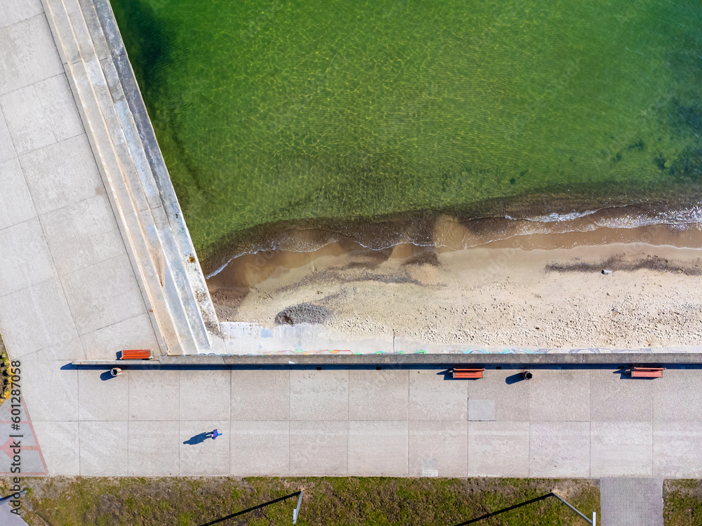 Aerial view landscape Poland Gdynia, city boulevard , drone photo, Baltic sea, concrete promenade, rocky coast.