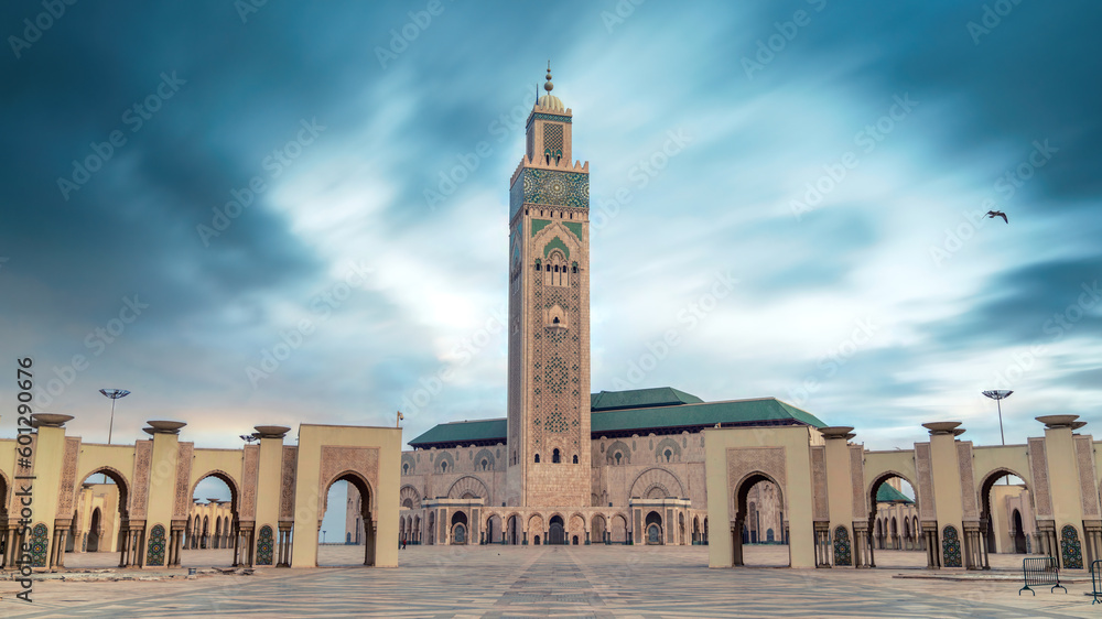 Casablanca, Morocco -April 2023: The Hassan II Mosque during sunset. Impressive architecture and intricate details showcase the country's rich cultural heritage and religious devotion.