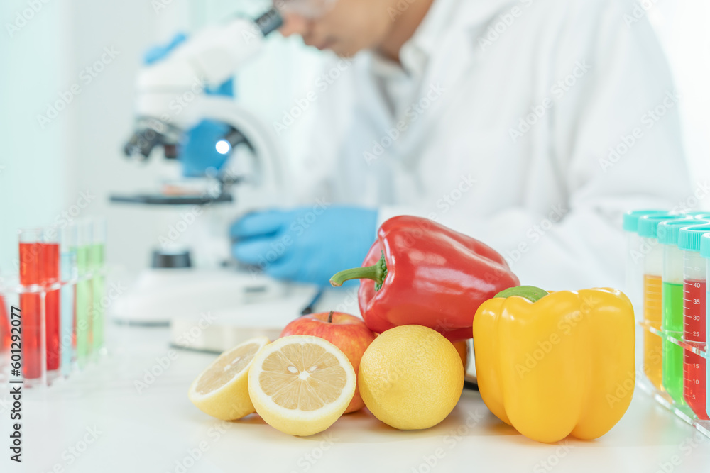 Scientist check chemical fruit residues in laboratory. Control experts inspect the concentration of chemical residues. hazards, standard, find prohibited substances, contaminate, Microbiologist Scientist check chemical fruit residues in laboratory. Control experts inspect the concentration of chemical residues. hazards, standard, find prohibited substances, contaminate, Microbiologist