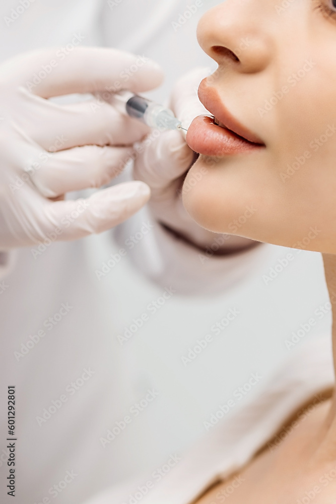 Naklejka premium Lip Augmentation. Woman Getting Beauty Injection For Lips