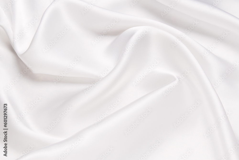 White fabric texture background. Cloth soft wave. Creases of satin, silk, and cotton.