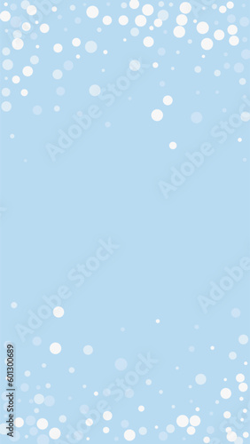 Beautiful snowfall christmas background. Subtle flying snow flakes and stars on light blue winter backdrop. Beautiful snowfall overlay template. Vertical vector illustration.