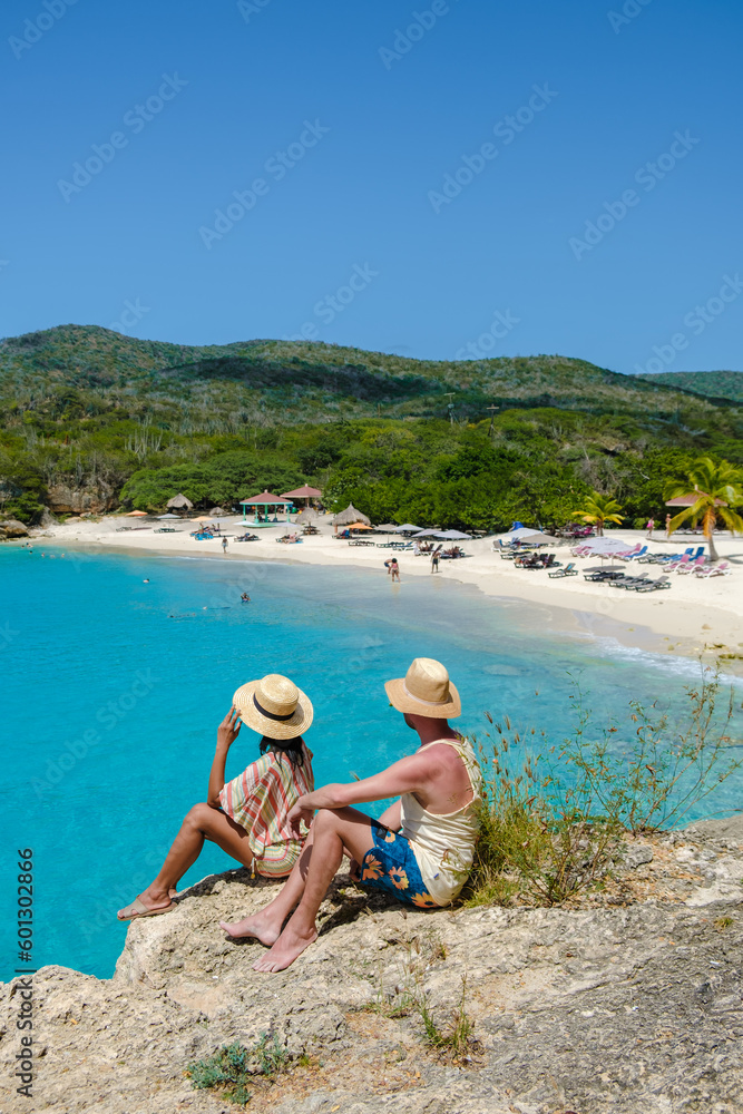 Grote Knip Beach Curacao Island, a Tropical beach on the Caribbean island of Curacao Caribbean. A couple of men and a woman on vacation in Curacao Grote Knip Beach Curacao Island, a Tropical beach on the Caribbean island of Curacao Caribbean. A couple of men and a woman on vacation in Curacao