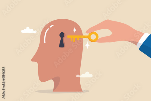 Unlock true potential or motivation to set new mindset, key to success or career achievement, learning or imagination concept, businessman hand putting golden key to unlock potential in human brain.