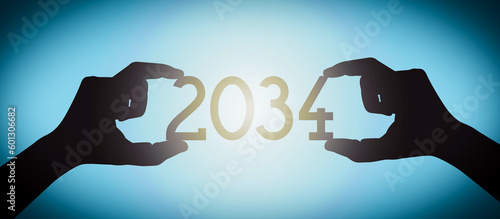 2034 - human hands holding black silhouette year number