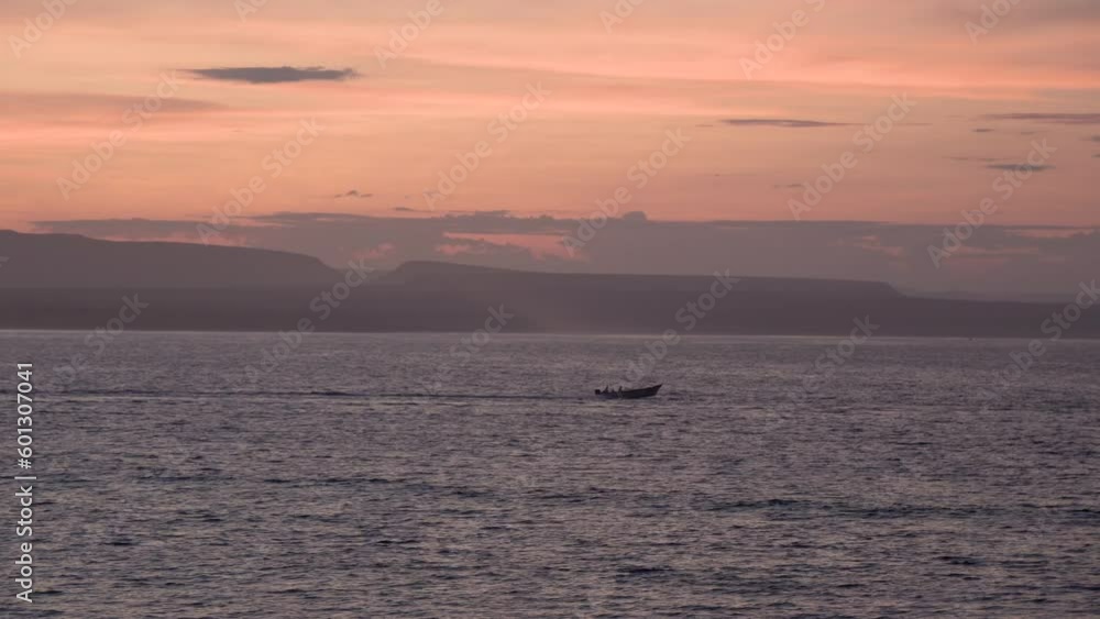 Fishing boat passing fast during sunset in Baja California Mexico with flying birds, Wide follow right shot Fishing boat passing fast during sunset in Baja California Mexico with flying birds, Wide follow right shot
