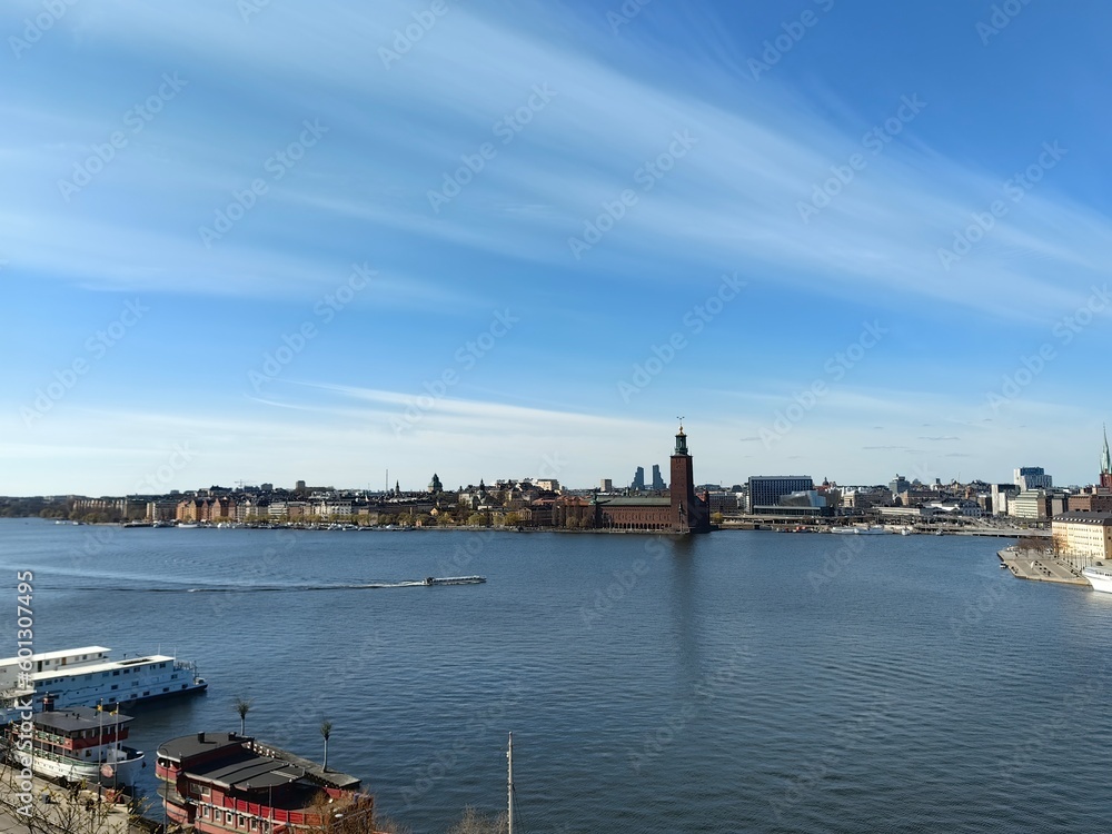 Panoramic view of Gamla Stan - the old town of Stockholm against the backdrop of water and blue sky.