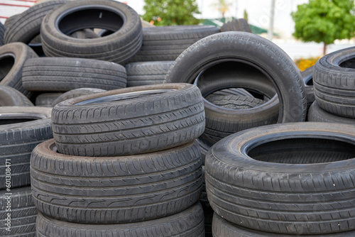 A pile of old car rubber tyres