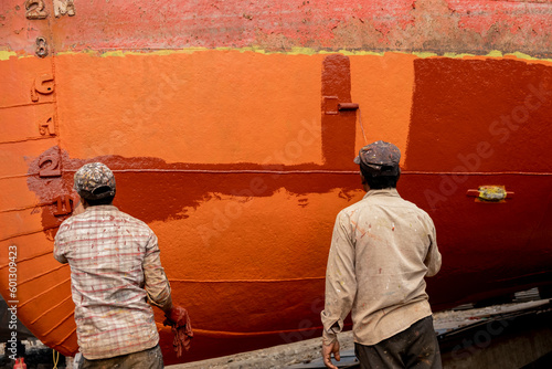 Dhaka Shipyard, Keraniganj, Bangladesh. The shipyards along the outskirts of the Bangladesh capital are a flurry dangerous boat breaking and rebuilding.  photo