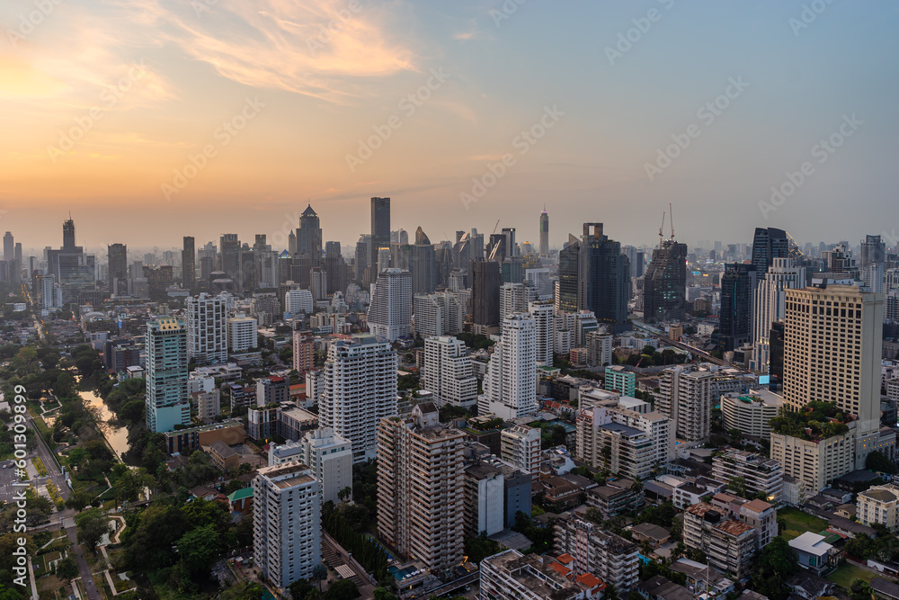 Panoramic cityscape of Bangkok city metropolis in twilight during the sunset. Skyline urban panorama of modern city at dusk. High-angle view