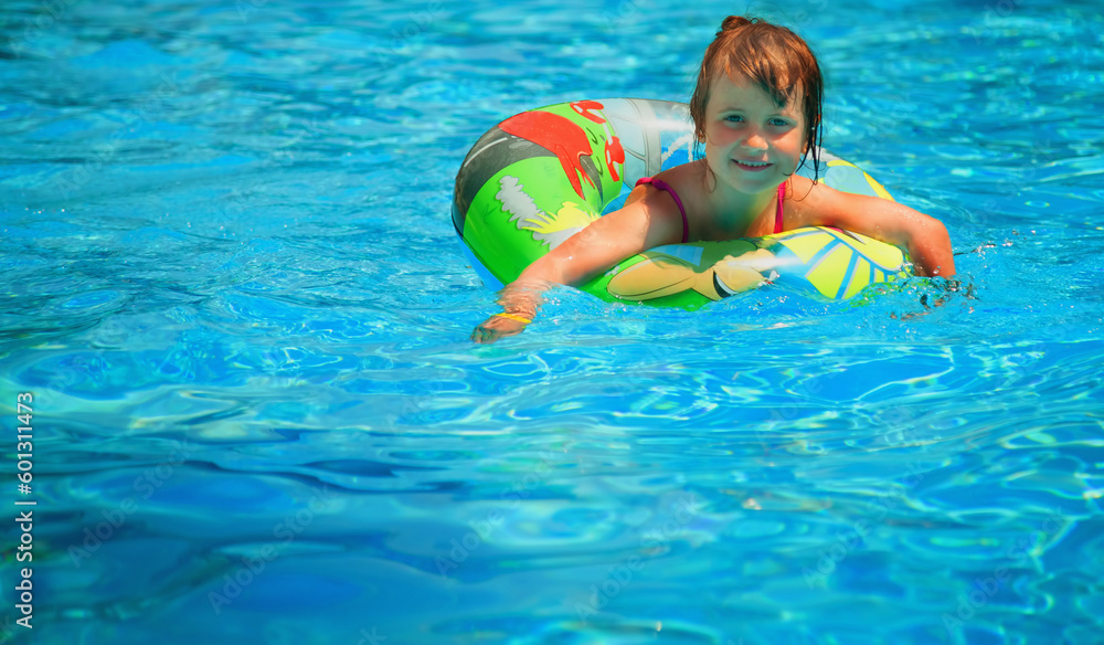 Pretty little child girl in the outdoor pool. Horizontal image. Copy space.