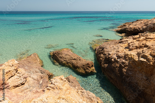 Peaceful vacation spot on the Mediterranean Sea. Rocks on turquoise water at Santa Margherita di Pula, Sardinia Italy. 