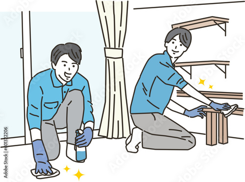 部屋で床掃除をする清掃業の若い男性達
