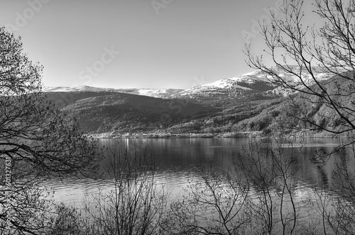 Nordfjord in Norway in black and white. View of mountains covered with snow.