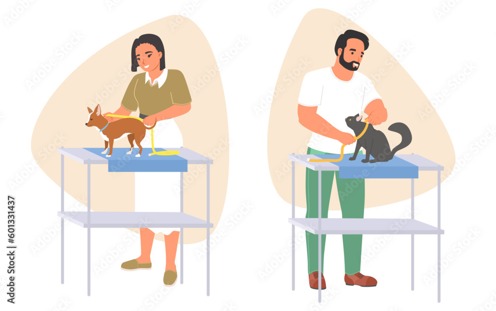 Man and woman seamstress taking measurement of pets Man and woman seamstress taking measurement of pets