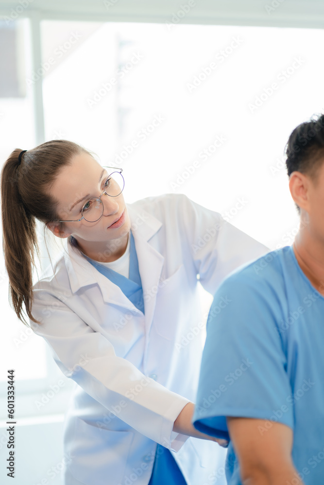 Patient at the physiotherapy doing physical exercises with docter therapist. Patient at the physiotherapy doing physical exercises with docter therapist.