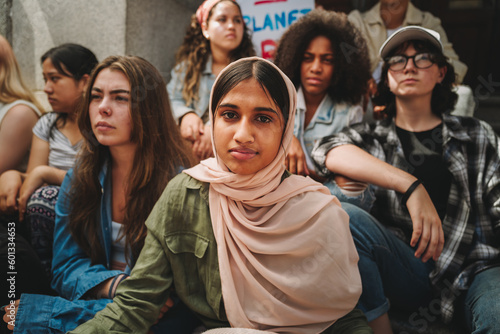 Muslim girl sitting with a group of activists © Jacob Lund