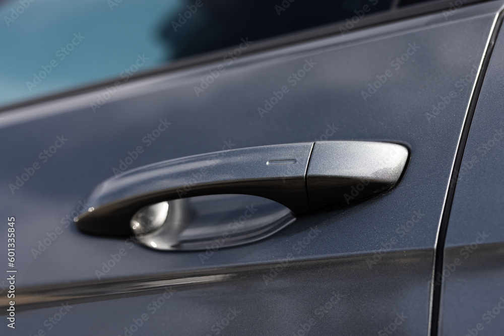 Car door handle with unlock button. Keyless entry car door handle with touch sensor. Access button. Modern car. Car security concept