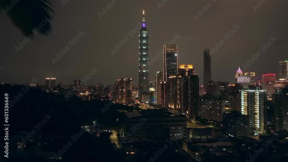 Aerial forward shot showing cityscape skyline of taipei city at night - along palm trees and skyscraper 101 tower
Aerial forward shot showing cityscape skyline of taipei city at night - along palm trees and skyscraper 101 tower