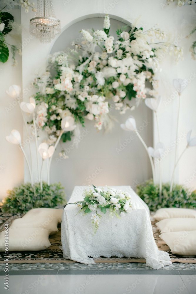 A luxurious Indonesian-style wedding altar with a grand table and chairs, adorned with intricate carvings and gold accents, fit for a royal wedding A luxurious Indonesian-style wedding altar with a grand table and chairs, adorned with intricate carvings and gold accents, fit for a royal wedding