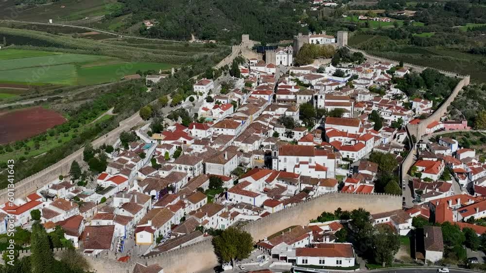 Obidos Town in Portugal. It is located on a hilltop, encircled by a fortified wall. Famous Place. 4k Obidos Town in Portugal. It is located on a hilltop, encircled by a fortified wall. Famous Place. 4k