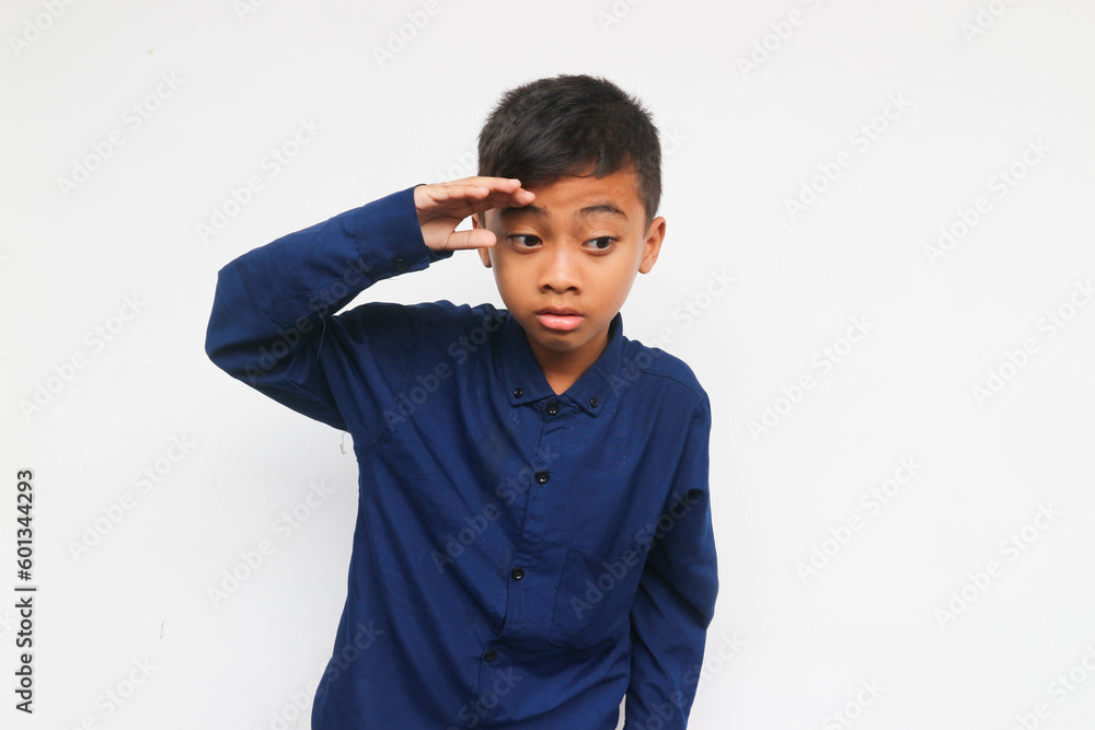 Curious boy looking and find something isolated on the white background Curious boy looking and find something isolated on the white background