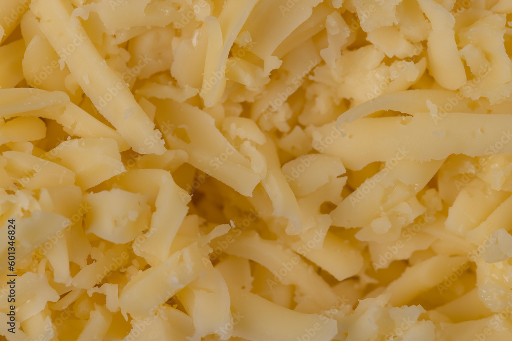 Hard cheese with holes grated into thin small slices Hard cheese with holes grated into thin small slices