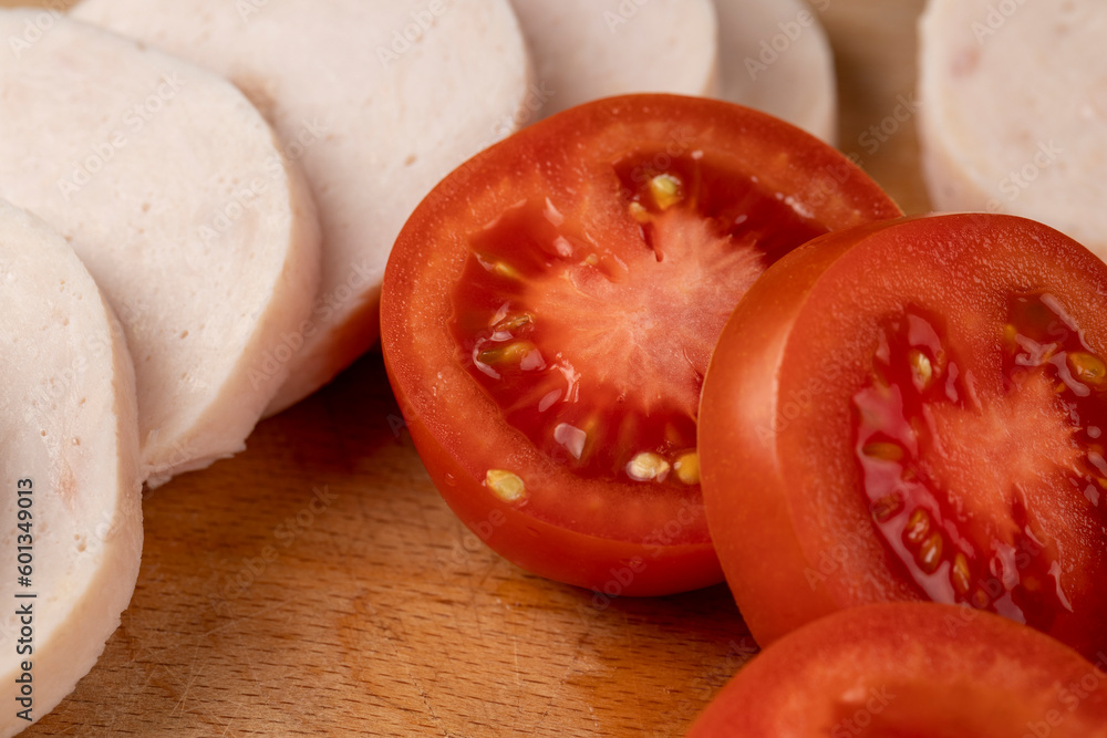 Sliced ripe red tomato on the table