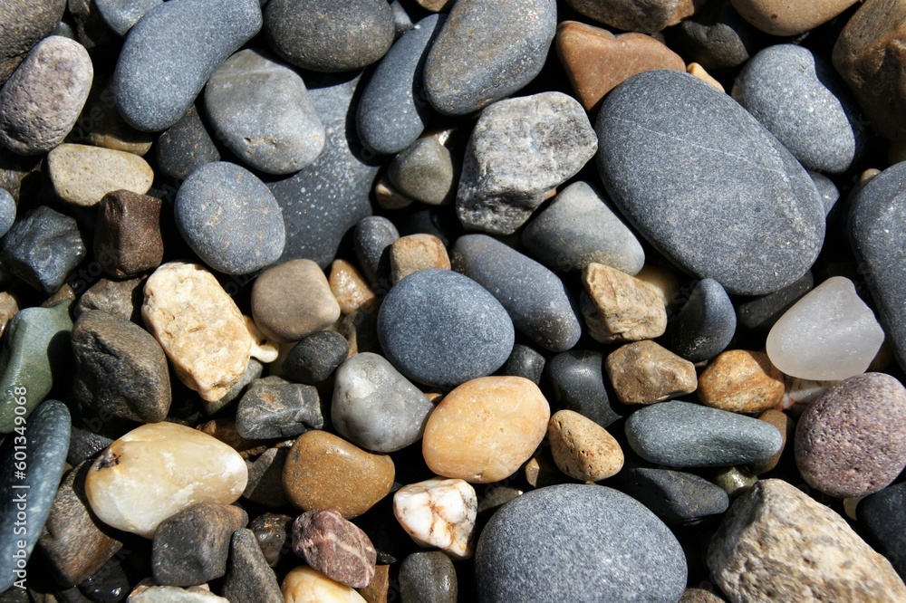 Stones of different sizes on the beach. Background texture. Stones of different sizes on the beach. Background texture.