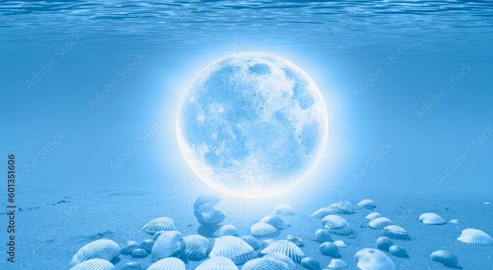 Full moon under water on the blue tropical beach Full moon under water on the blue tropical beach