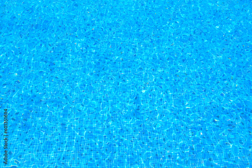 Blue water ripples in swimming pool with blue mosaic background , Abstract Water waves surface