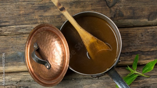 Culinary Artistry: Top-View Close-up of Rich Gravy in a Copper Pot in 4k photo