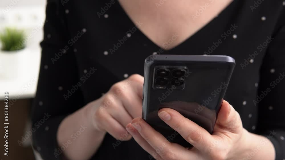 Female hands with mobile phone, woman finger touching screen, texting or searching something in internet. Browsing, shopping online Female hands with mobile phone, woman finger touching screen, texting or searching something in internet. Browsing, shopping online